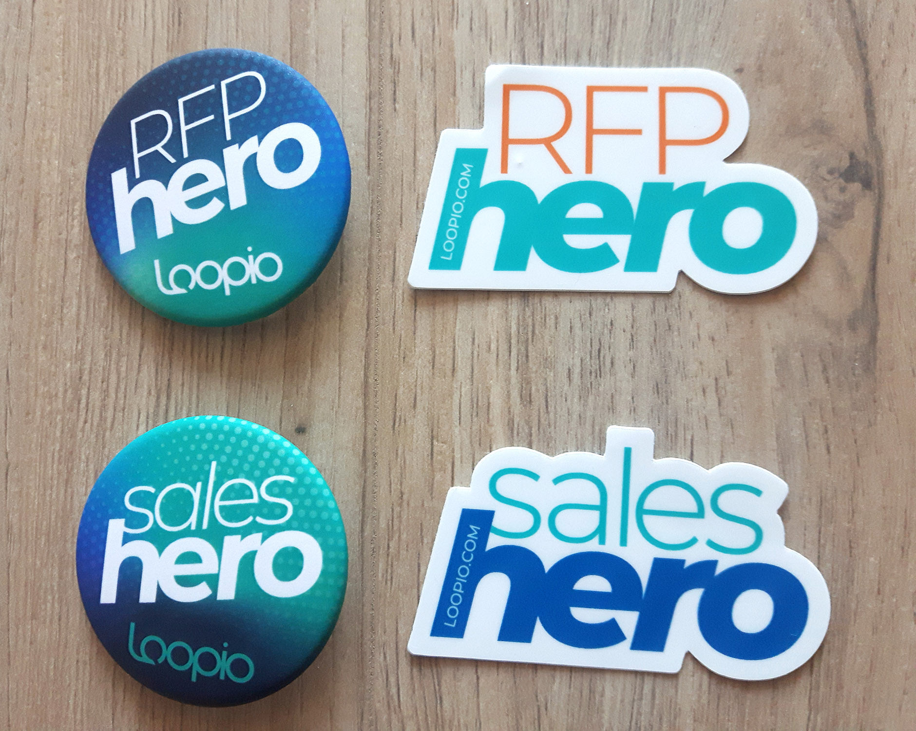 Two pins and two stickers for RFP and Sales Heroes